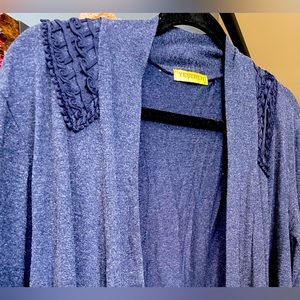 Open Women's jacket dark blu color, mid length, long sleeves, and light piece.